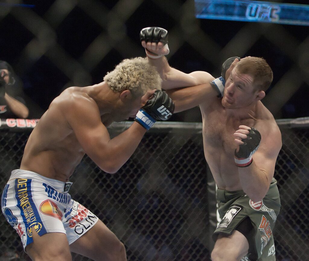 Sept. 24, 2011 - Denver, Colorado U.S. - MATT HUGHES, right, exchanges with JOSH KOSCHECK, left, during UFC 135 at the Pepsi Center Saturday night. KOSCHECK wins by TKO over HUGHES in the 1st. round. UFC 2011 - UFC 135 - Undercard - ZUMAav4