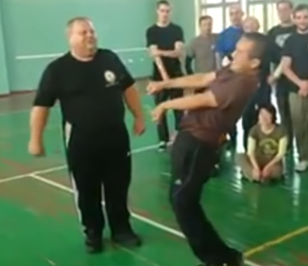 Portly Systema instructor smiles more as training partner seizes up.