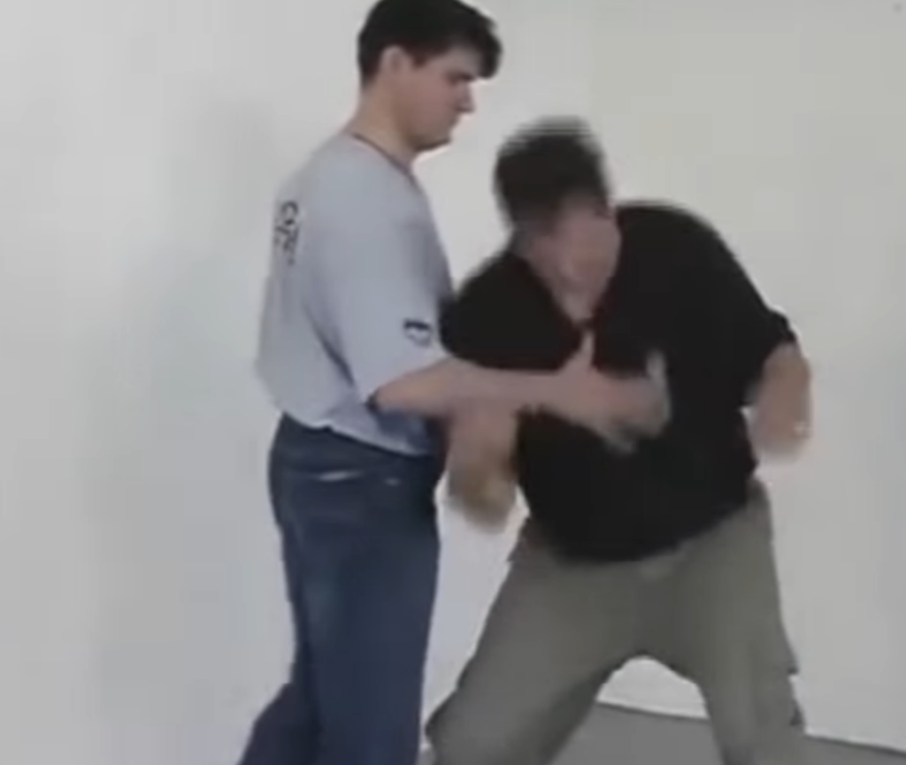 Systema instructor has training partner fall back after flicking his thumb under opponent's chin.