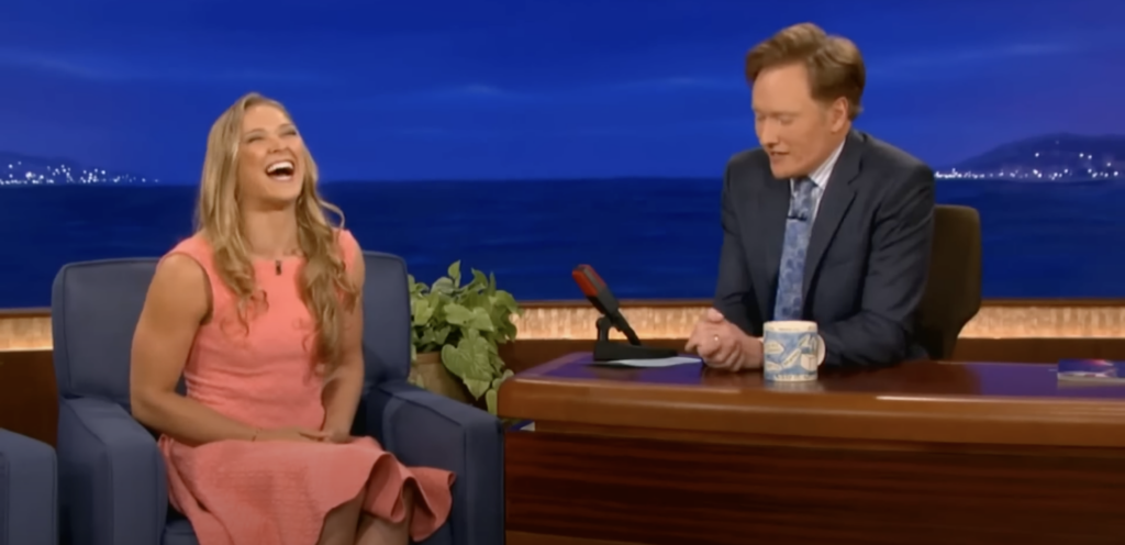 Ronda Rousey appeared in Conan as a Strikeforce champion, at a time when Dana White says UFC "could never f--ing get on" mainstream talk shows.